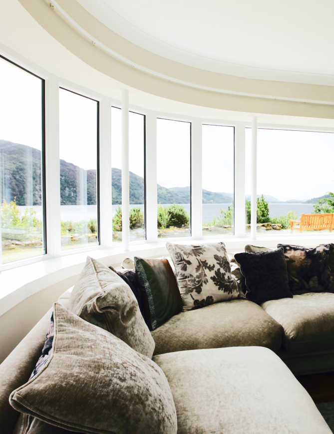 Seating area with bay window in Point Clair House